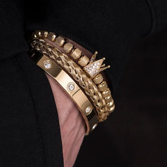 Elegant gold bracelets featuring intricate designs and sparkling accents, showcasing luxury and style.